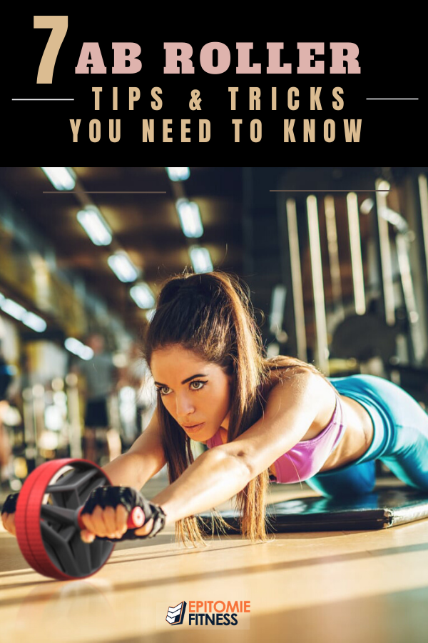 Woman working out with an ab roller in gym